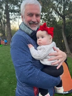 Rick poses with one of his five grandchildren, Wavely.