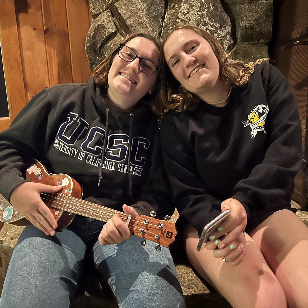 Two Women Sitting Together with Ukulele